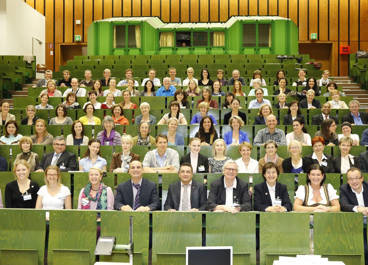 Crowd of people sitting in a lecture hall