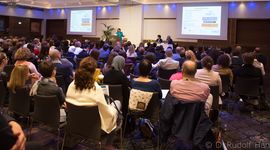 People listening to a speaker at a conference in Salzburg about clinical care and research in Epidermolysis Bullosa